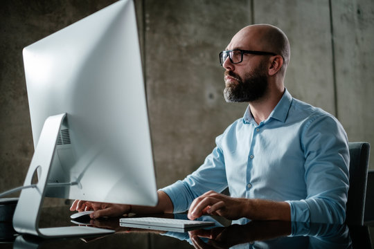 Middle-aged Designer Working In Office