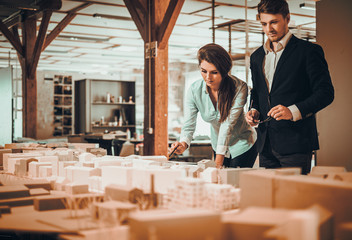 Confident team of engineers working together in a architect studio