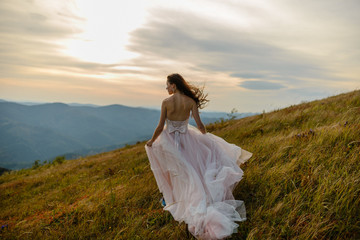 Bride in the mountains. The concept of lifestyle and wedding.