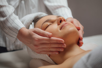 Woman Enjoying a Facial Massage