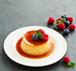 delicious dessert creme brulee with berries.
