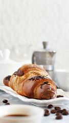 Breakfast with coffee and croissant