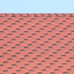 Decorative metal tile on a roof