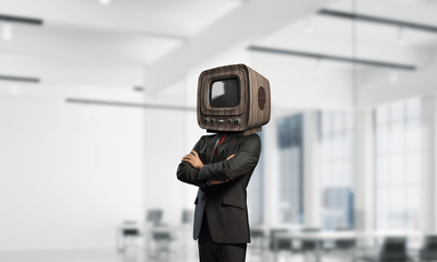 Businessman with old TV instead of head.