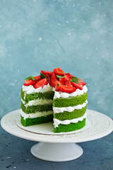 Cake with spinach, cream and strawberries. Valentine's Day.
