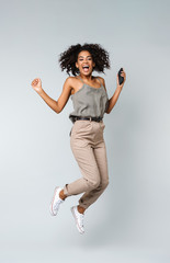 Full length of a happy young african woman