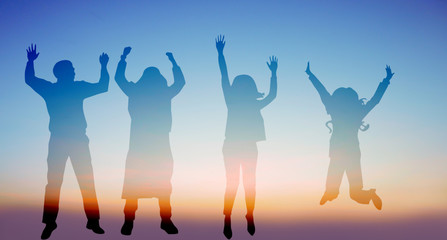 Success of teamwork collaboration and freedom on silhouette sunset background. business concept.