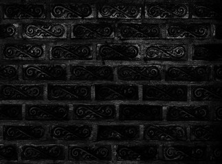 Beautiful ornamental classic style of brick wall pattern background, traditional pattern of black square painted block decorated with vine shape background, black vintage wall for decoration