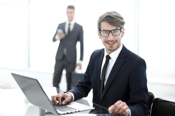 two young entrepreneurs working in the office