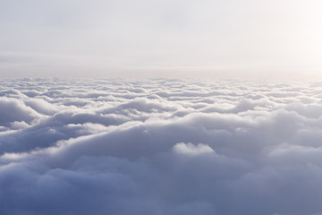 Flying above the clouds. View from the plane window