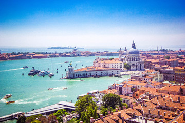 Panoramic view of Venice - Basilica Santa Maria della Salute, Grand Canal with gondolas and red...