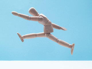 man jumping on blue sky background