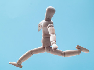 man jumping on blue sky background