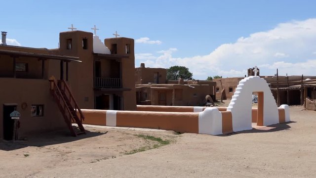 Old Catholic church, Taos Pueblo, Santa Fe County, New Mexico, United States of America. View of small Native American village in the Southwest US. National Historic Landmark and UNESCO Heritage Site