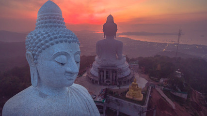 aerial view sunrise at Phuket big Buddha on hilltop.Phuket big Buddha is one of the island most important and revered .landmarks on Phuket island.. © Narong Niemhom