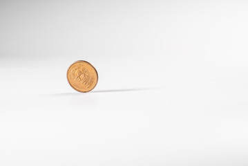 Dollar coin rotating on white background, concept of American economy.