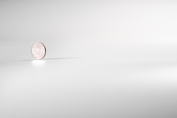 Dollar coin rotating on white background, concept of American economy.
