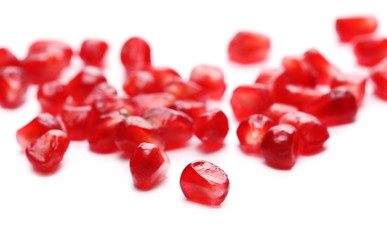 Pomegranate seeds isolated on white background, macro