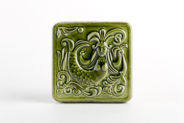 tile with the image of the deity