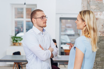 Businesswoman and man having a serious discussion