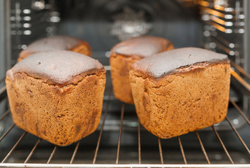 The fresh baked fragrant bread from rye flour. Bread is powdered with flour