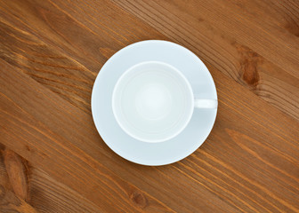Empty coffee couple white cup and saucer. Top view, isolated on wooden background