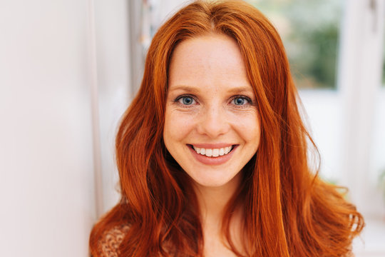 Young red-haired woman close-up portrait