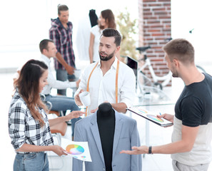 young designers discussing male costume