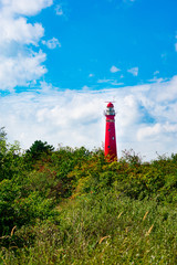 Red lighthouse on a sunny sommer day