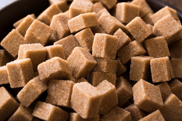 Raw Organic Brown Sugar Cubes Macro Close Up View. Ready to Eat.