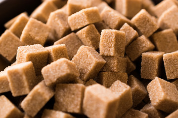 Raw Organic Brown Sugar Cubes Macro Close Up View. Ready to Eat.