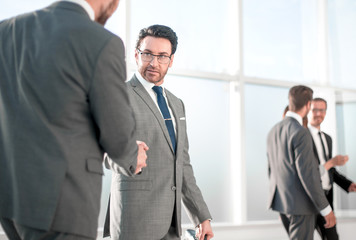 businessmen handshaking after striking deal