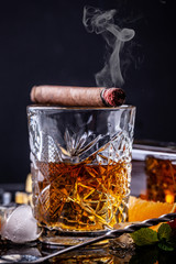 concept of alcoholism, loneliness, dependence. A bottle of whiskey, a glass of whiskey and with...