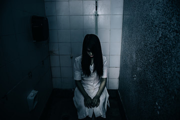 Portrait of asian woman make up ghost face with blood,Horror scene,Scary background,Halloween...
