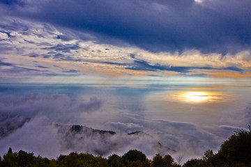 sunset sun is reflected in the sea, the view from the high mountain on the sea shore