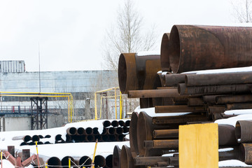 Metal rolling. A round tube large diameter are stacked in storage for sale and loading in stock in...