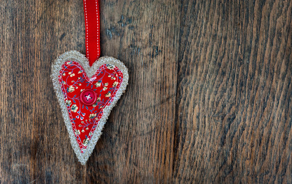 Love heart fabric on wooden table background