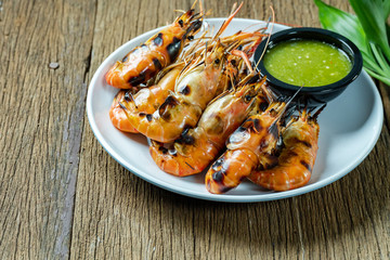 Grilled shrimps on a white plate