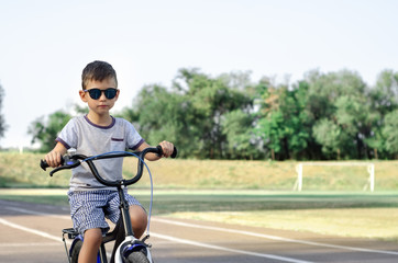 Fototapeta na wymiar Boy riding bicycle