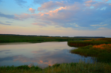 Fototapeta na wymiar Summer evening on the pond in the Tambov region and Russia.