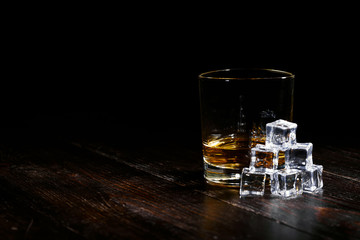 whiskey with ice in modern glasses