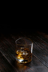 whiskey with ice in modern glasses
