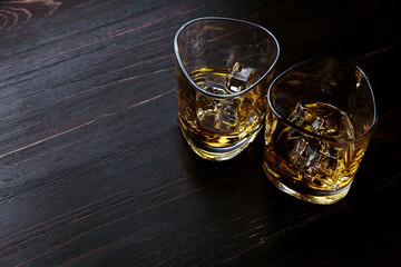 whiskey with ice in modern glasses