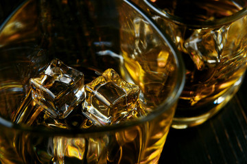 whiskey with ice in modern glasses
