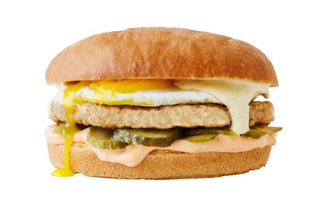 Chicken burger with egg and pickled cucumbers. Isolated on white background.