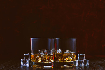 whiskey with ice in modern glasses
