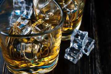 whiskey with ice in modern glasses