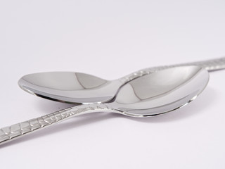 silverware forks spoons knives cutlery on a white background