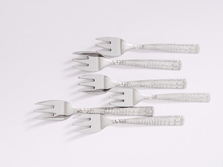 silverware forks spoons knives cutlery on a white background