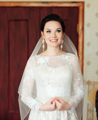 morning of the bride, a beautiful woman in a white dress is preparing for the wedding
